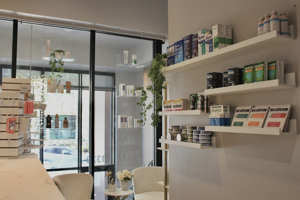The consultation corner inside Cunard Pharmacy & Clinic, with tall windows onto Lower Water Street